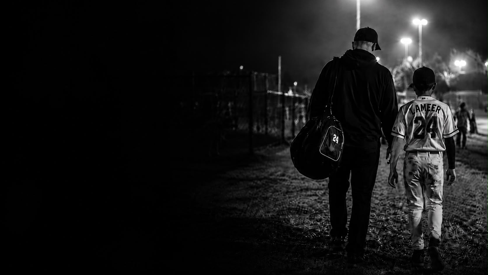 Young athlete sitting alone reflecting after a game